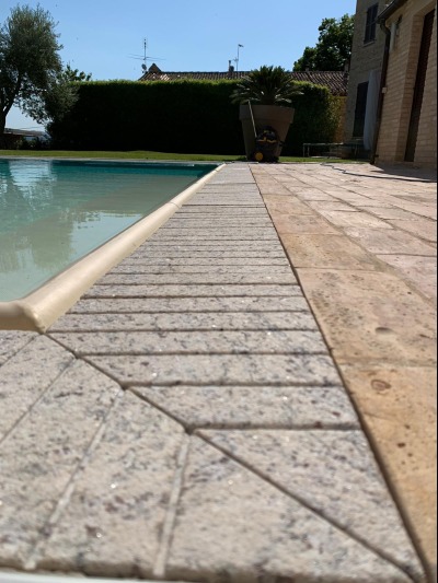 Ramella Graniti A- Project for new swimming pool with infinity grill in Giallo Bafico granite, private villa.