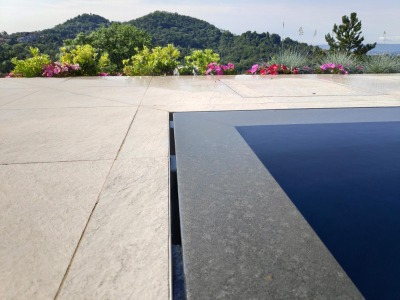 Ramella Graniti A- New infinity edge pool project in absolute black construction